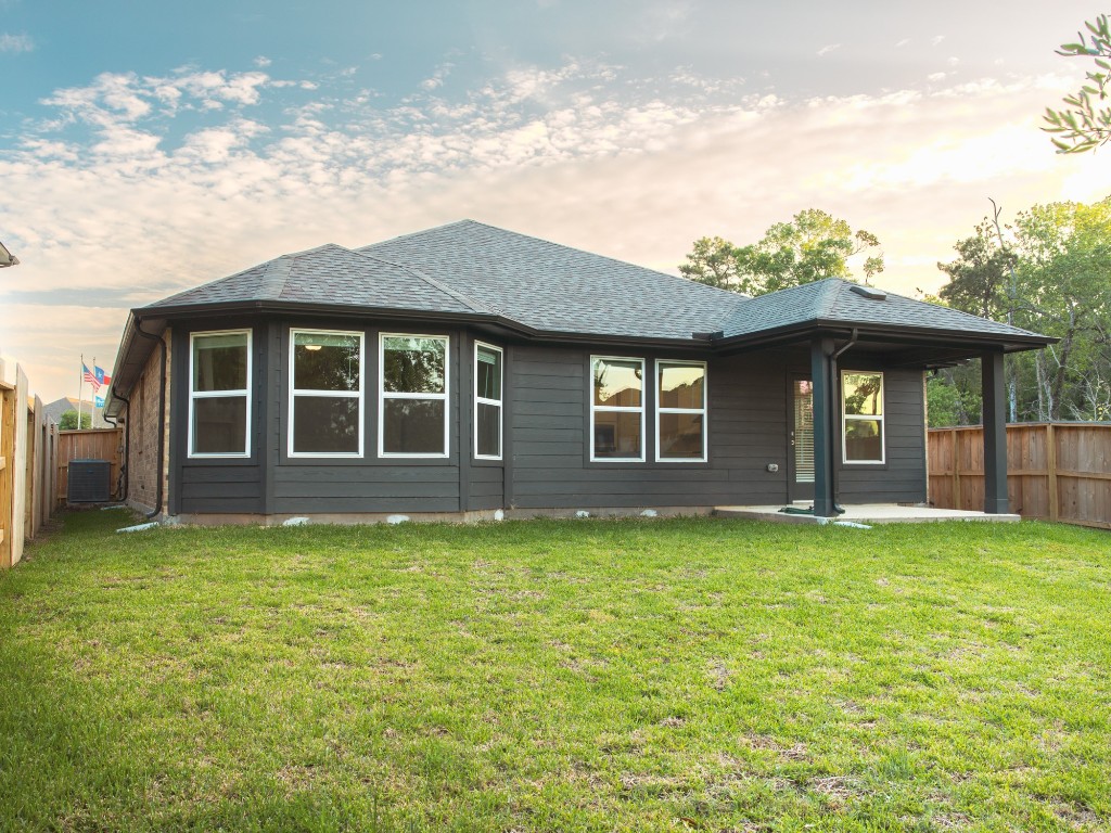 2010 Bluff Oak Street Conroe, TX 77304 - Photo 30 of 35 a view of a house with a yard