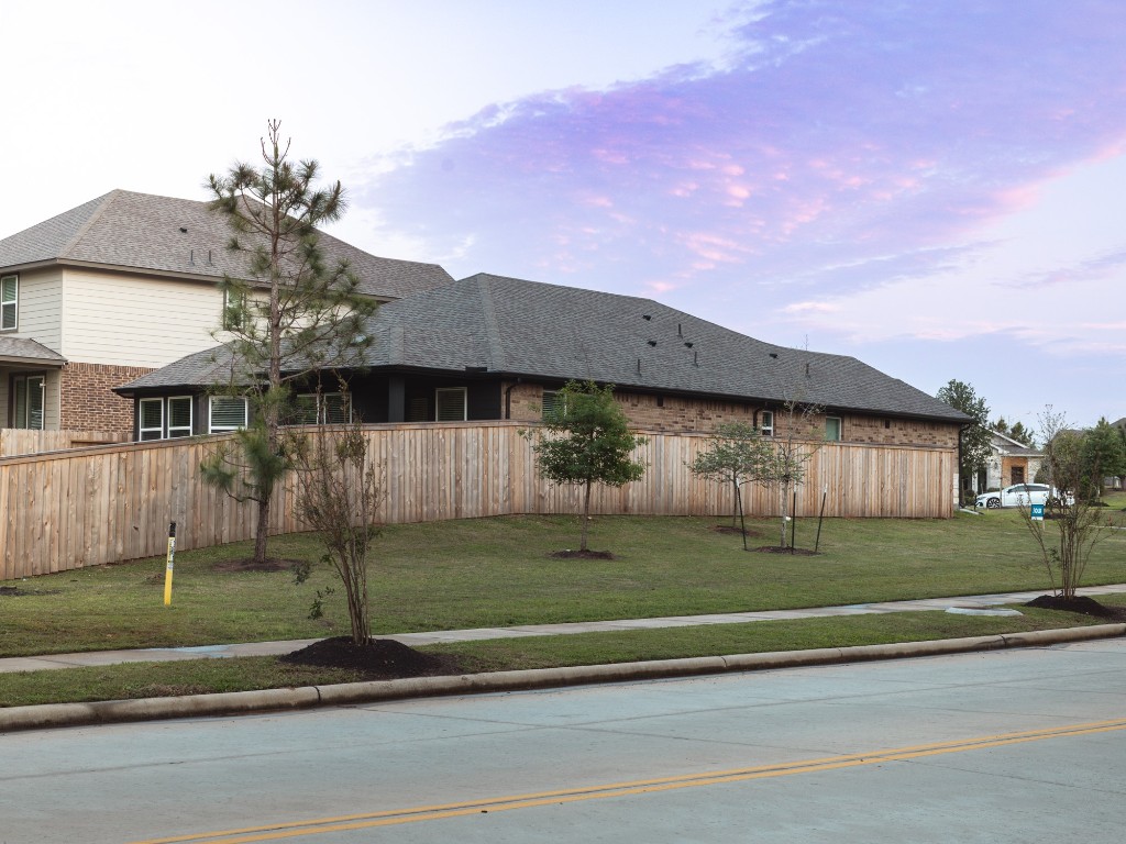 2010 Bluff Oak Street Conroe, TX 77304 - Photo 31 of 35 a front view of a house with a garden