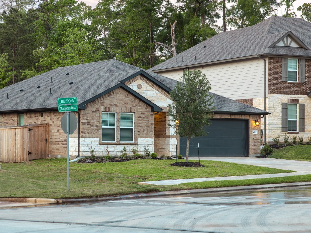2010 Bluff Oak Street Conroe, TX 77304 - Photo 32 of 35 a view of a house with a yard and large tree