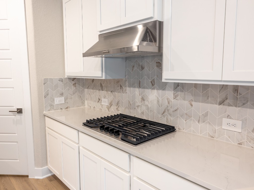 2010 Bluff Oak Street Conroe, TX 77304 - Photo 5 of 35 a kitchen with a sink and cabinets
