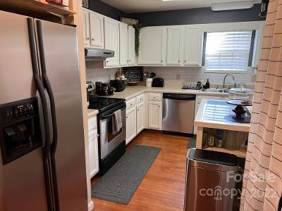 3474 Maiden Springs Road Maiden, NC 28650 - Photo 5 of 30 a kitchen with stainless steel appliances granite countertop a stove a refrigerator and a sink