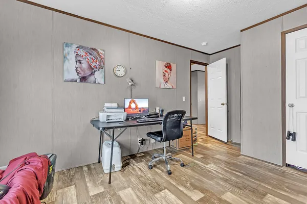 a workspace with furniture and wooden floor