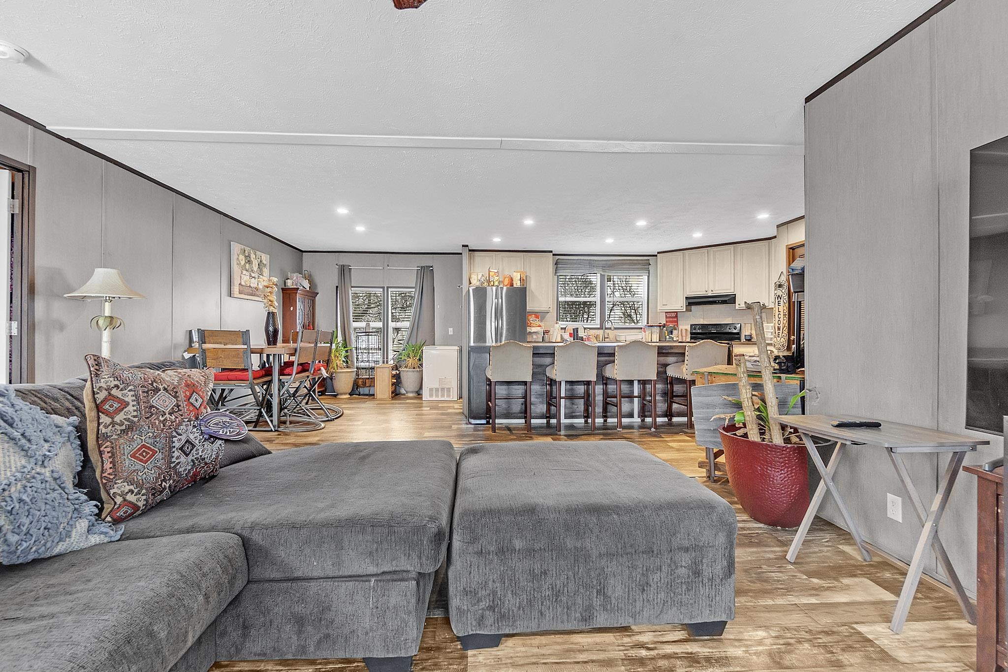 664 Rialto Road Covington, TN 38019 - Photo 5 of 22 Living room with light wood finished floors, recessed lighting, and a decorative wall