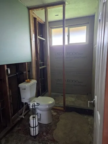 a living room with furniture window and wooden floor