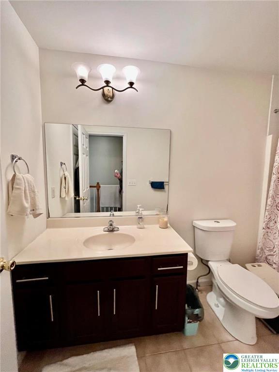 4164 Ross Road Bethlehem, PA 18020 - Photo 11 of 13 a bathroom with a sink vanity mirror and toilet