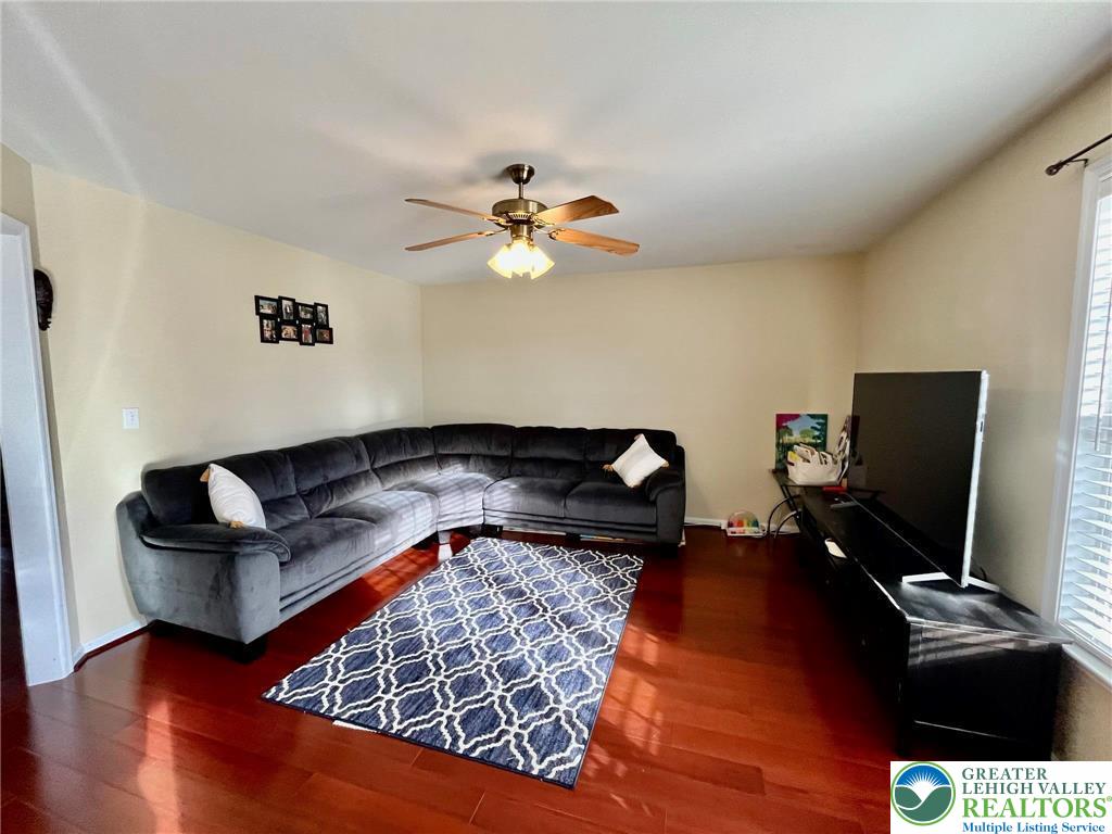 4164 Ross Road Bethlehem, PA 18020 - Photo 4 of 13 a living room with furniture and a flat screen tv