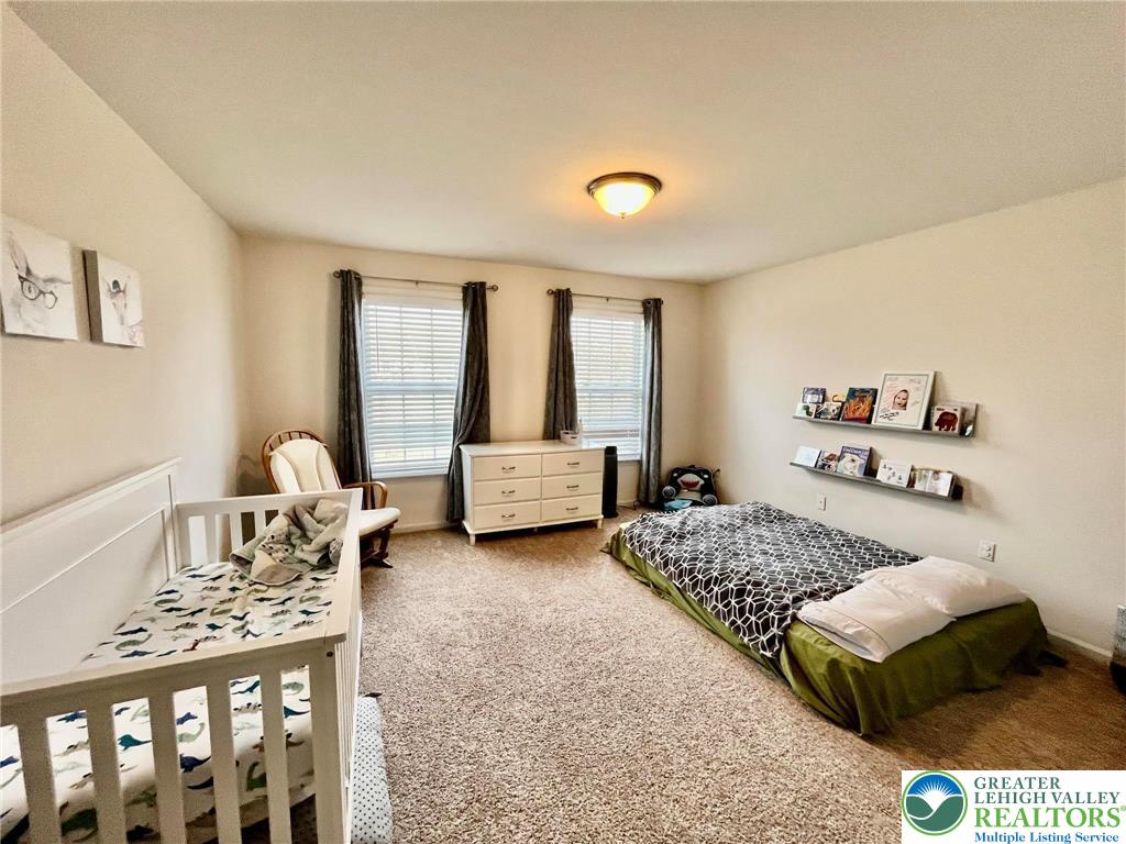 4164 Ross Road Bethlehem, PA 18020 - Photo 7 of 13 a bedroom with a bed and window