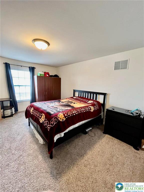 4164 Ross Road Bethlehem, PA 18020 - Photo 8 of 13 a bedroom with a bed and window