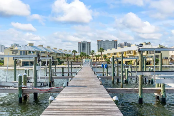 a view of a balcony with dining table and chairs