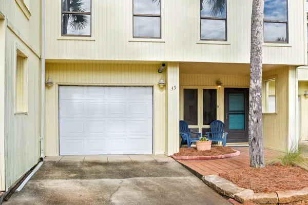a front view of a house with garage