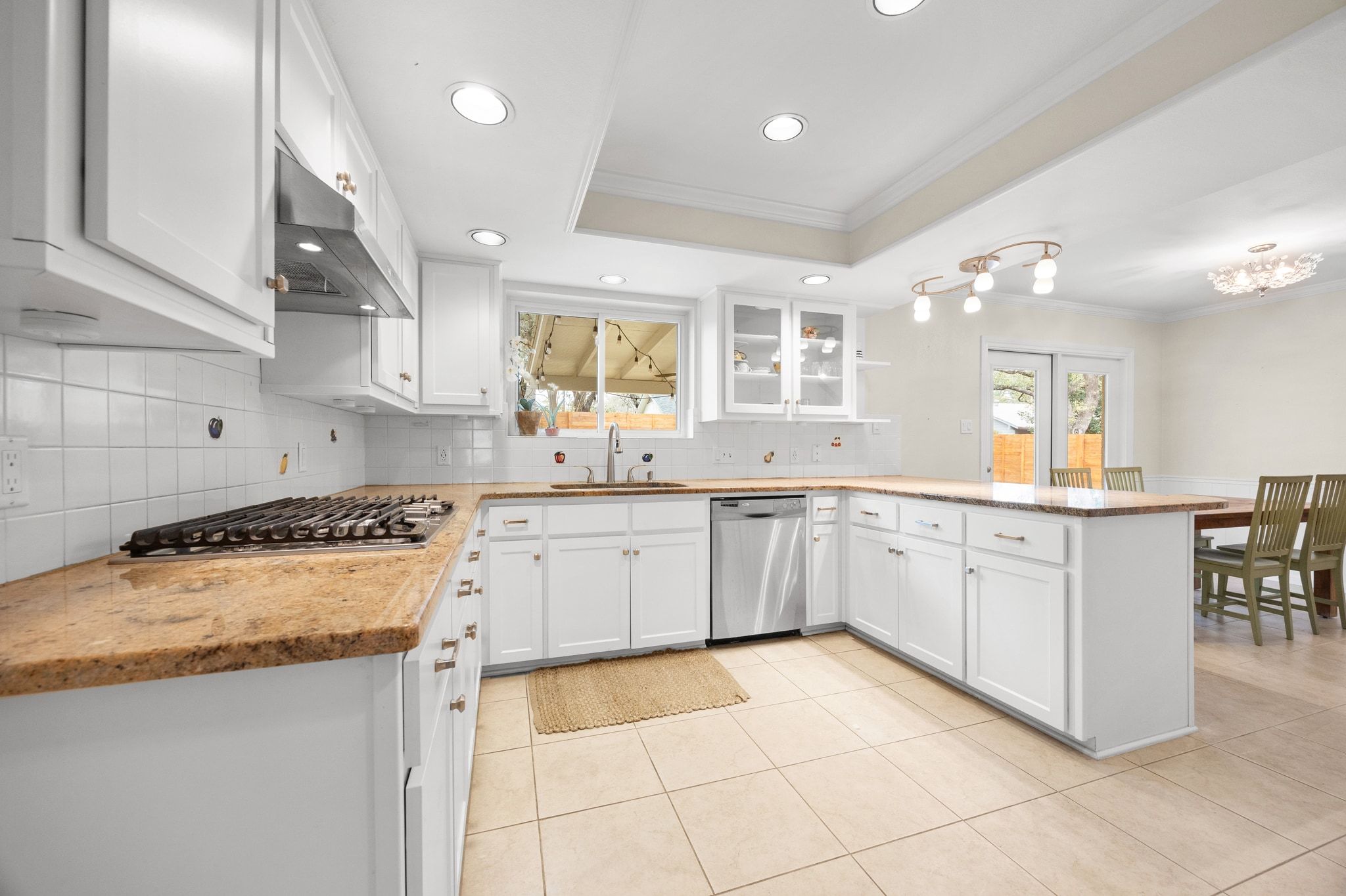 11204 Deadoak Lane Austin, TX 78759 - Photo 17 of 40 a kitchen with a sink and cabinets