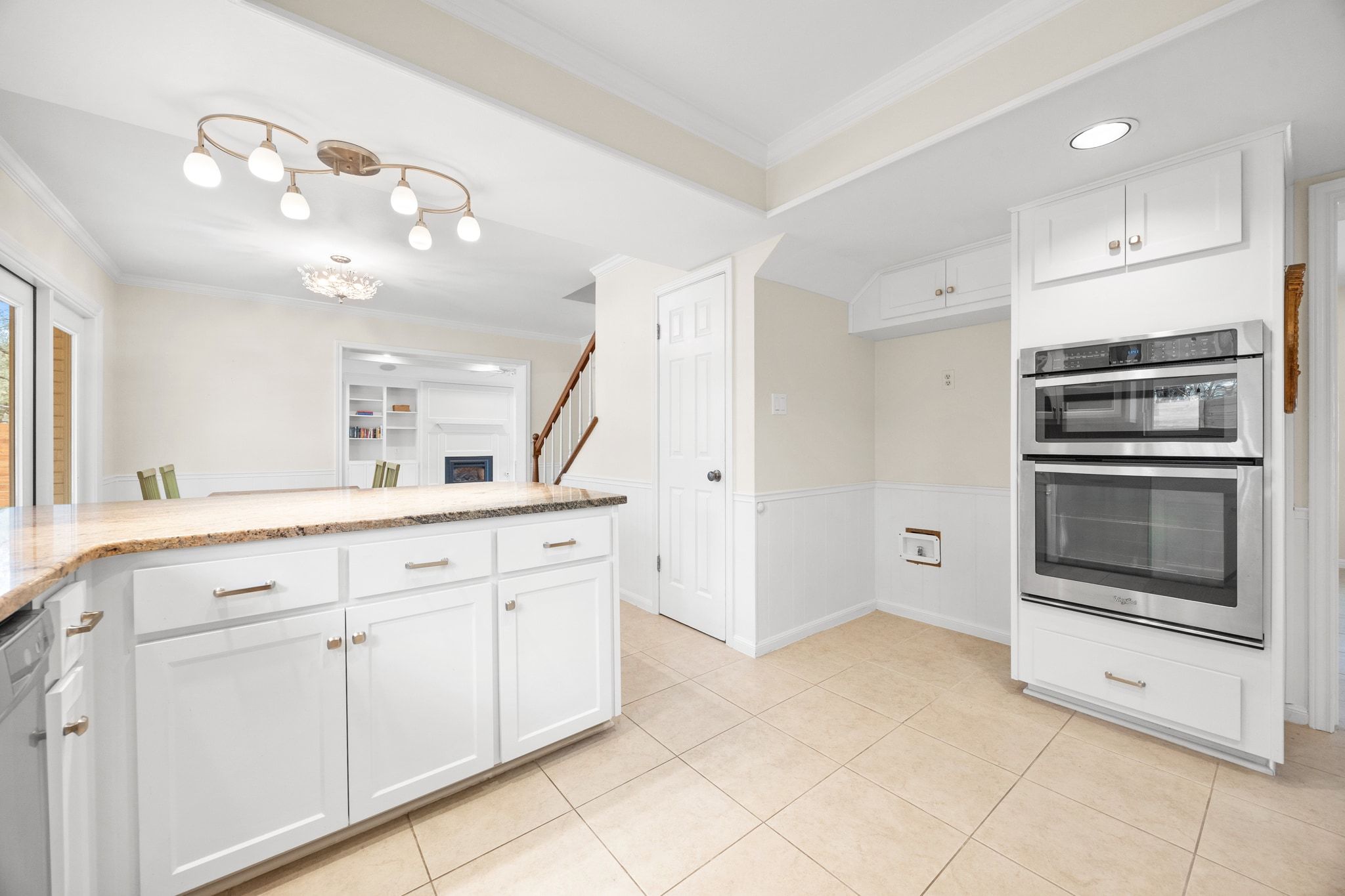11204 Deadoak Lane Austin, TX 78759 - Photo 18 of 40 a view of a kitchen with a sink and dishwasher a refrigerator with white cabinets