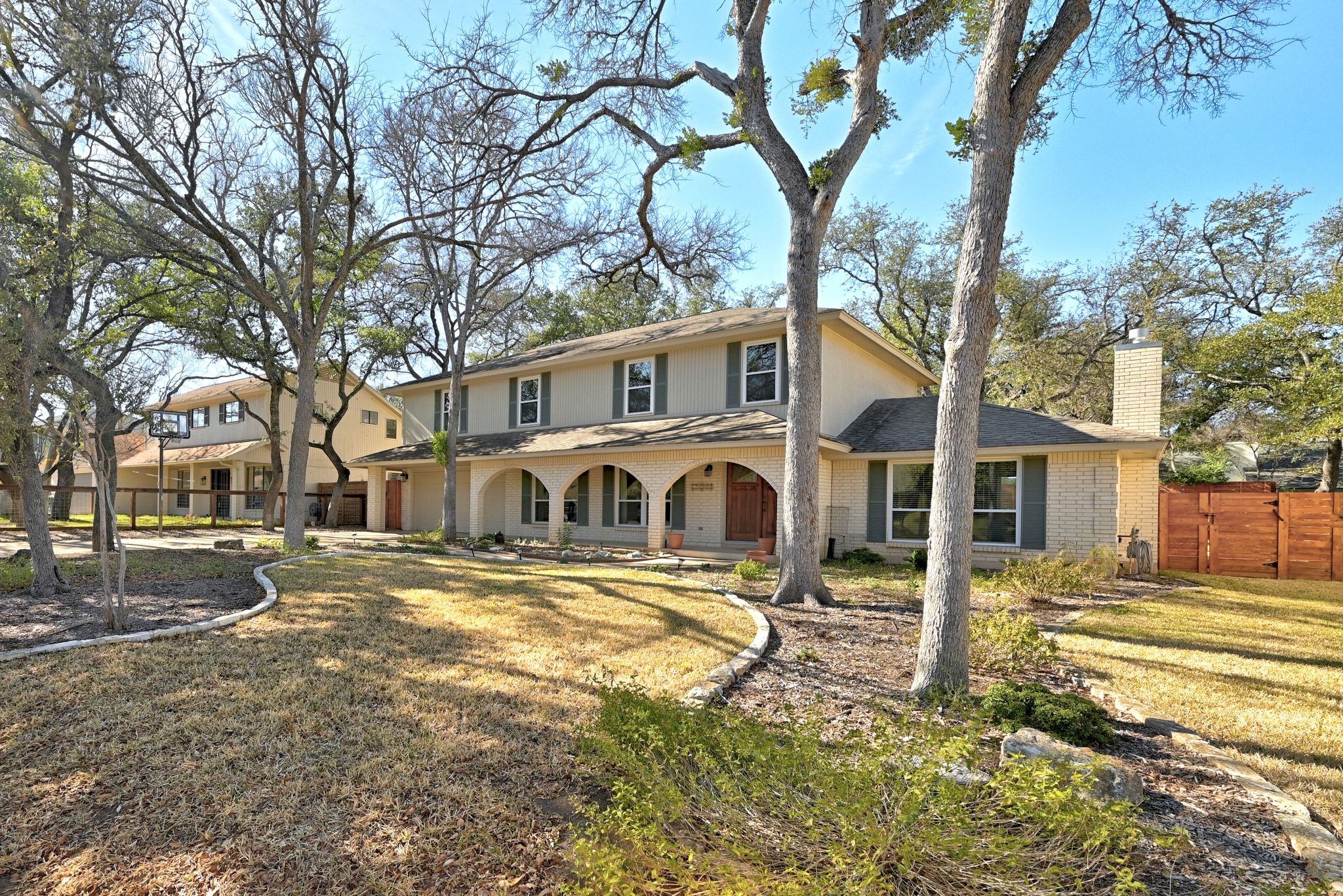 11204 Deadoak Lane Austin, TX 78759 - Photo 3 of 40 a front view of a house with a yard