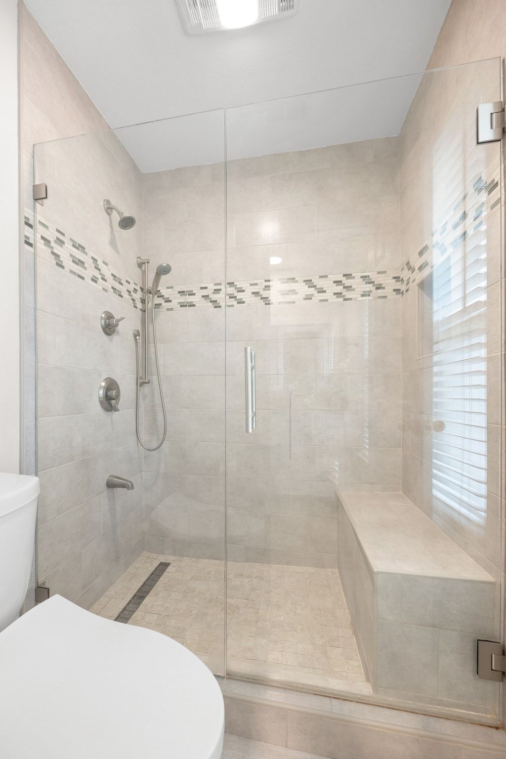 11204 Deadoak Lane Austin, TX 78759 - Photo 32 of 40 a bathroom with a shower and a toilet