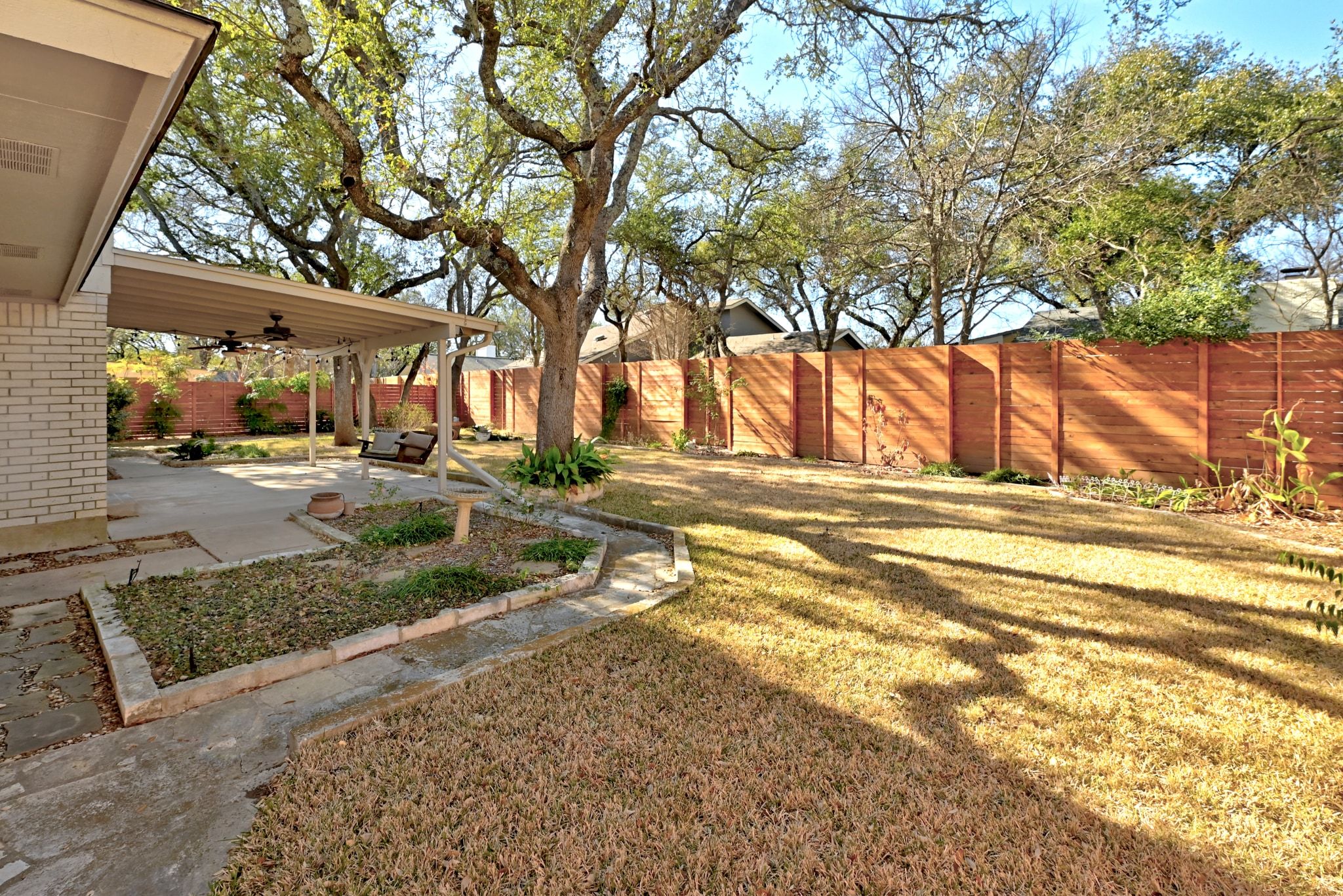 11204 Deadoak Lane Austin, TX 78759 - Photo 35 of 40 a view of a yard with a tree
