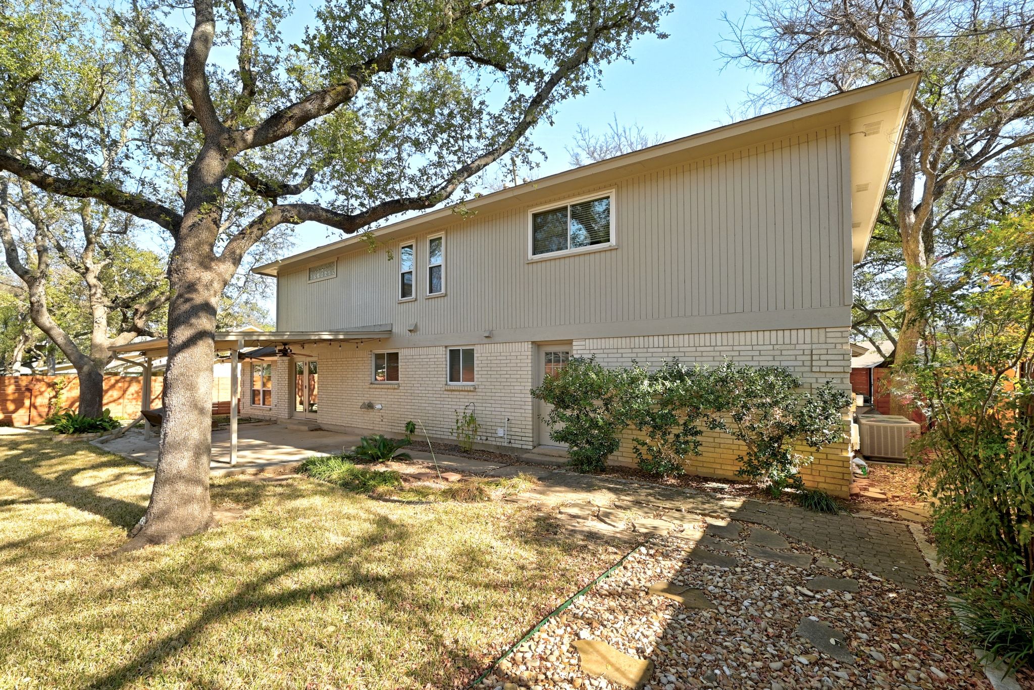 11204 Deadoak Lane Austin, TX 78759 - Photo 38 of 40 a view of a house with a yard