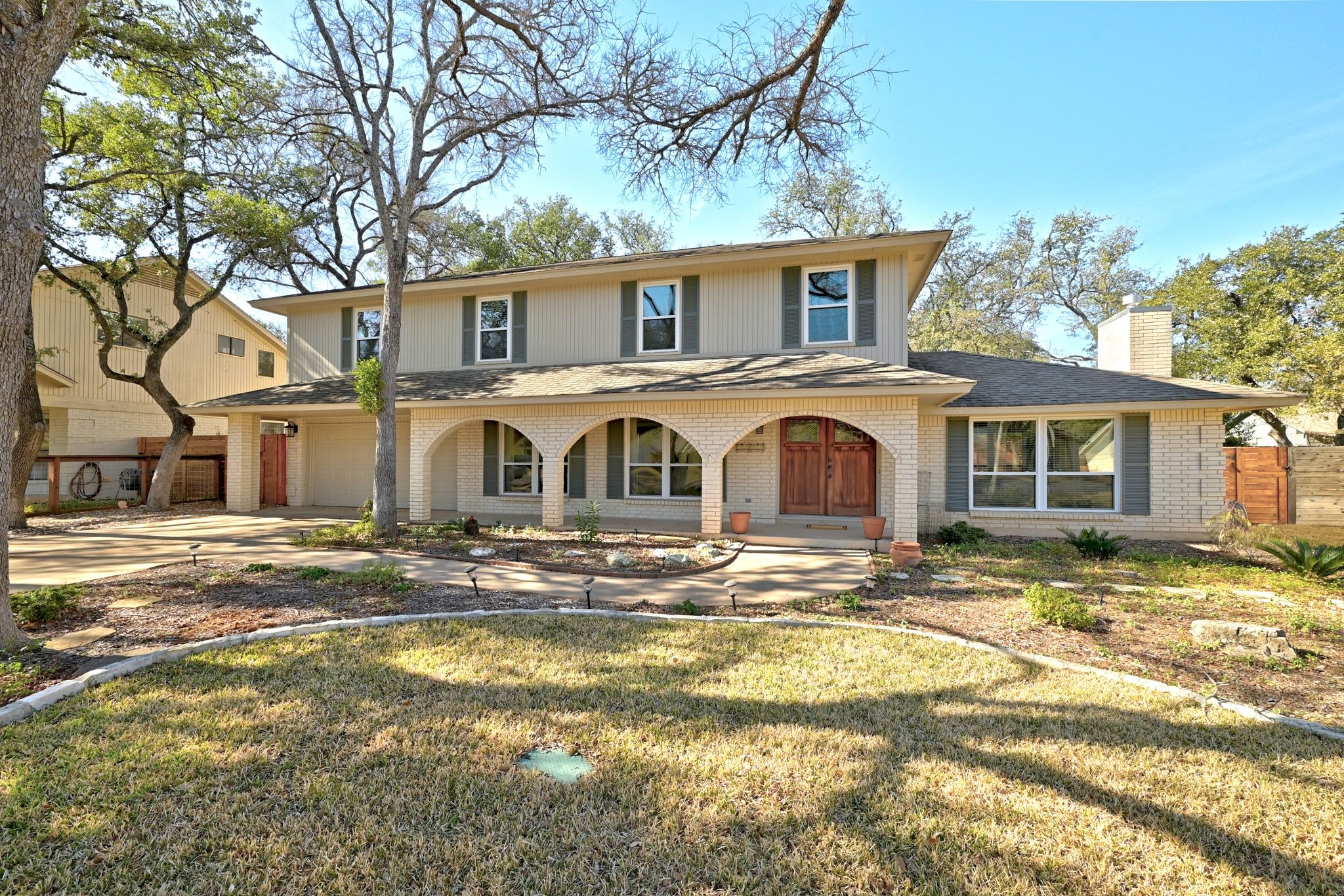 11204 Deadoak Lane Austin, TX 78759 - Photo 4 of 40 a front view of a house with a yard