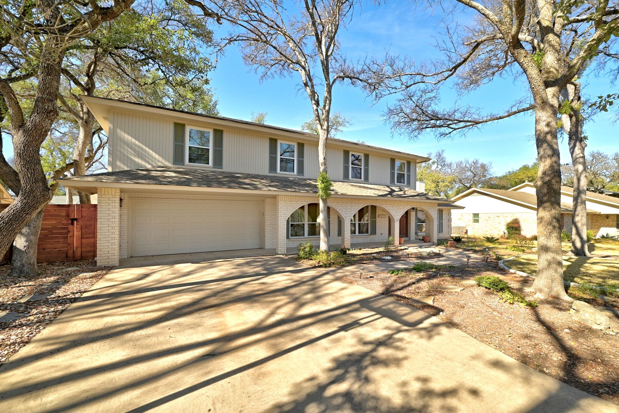11204 Deadoak Lane Austin, TX 78759 - Photo 5 of 40 a front view of a house with a yard