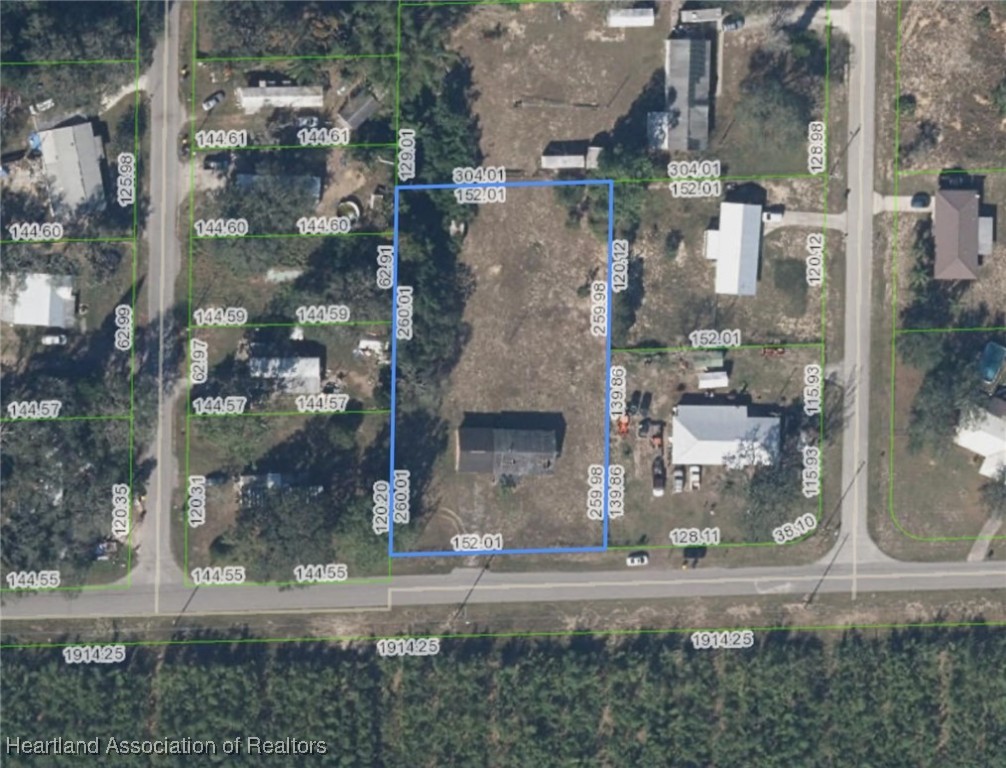 6016 Mike Kahn Road Sebring, FL 33876 - Photo 2 of 2 a view of a city from a building