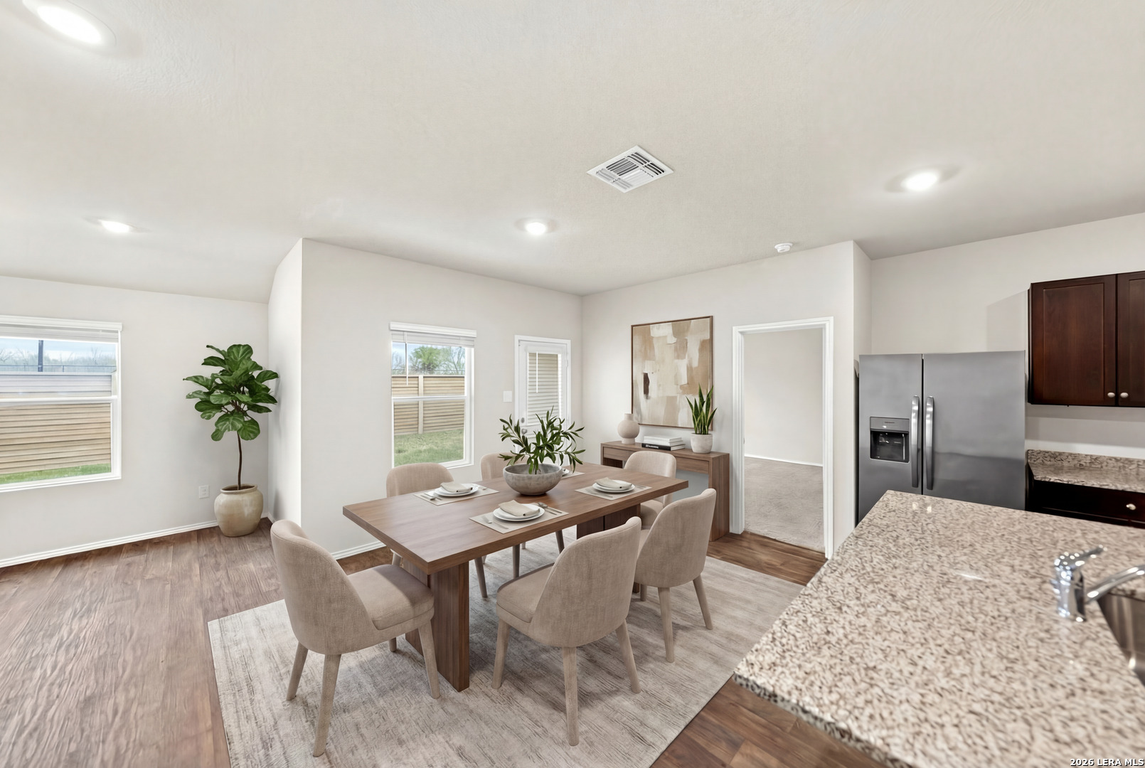917 Chachalaca Court Seguin, TX 78155 - Photo 13 of 44 a view of a dining room with furniture window and wooden floor