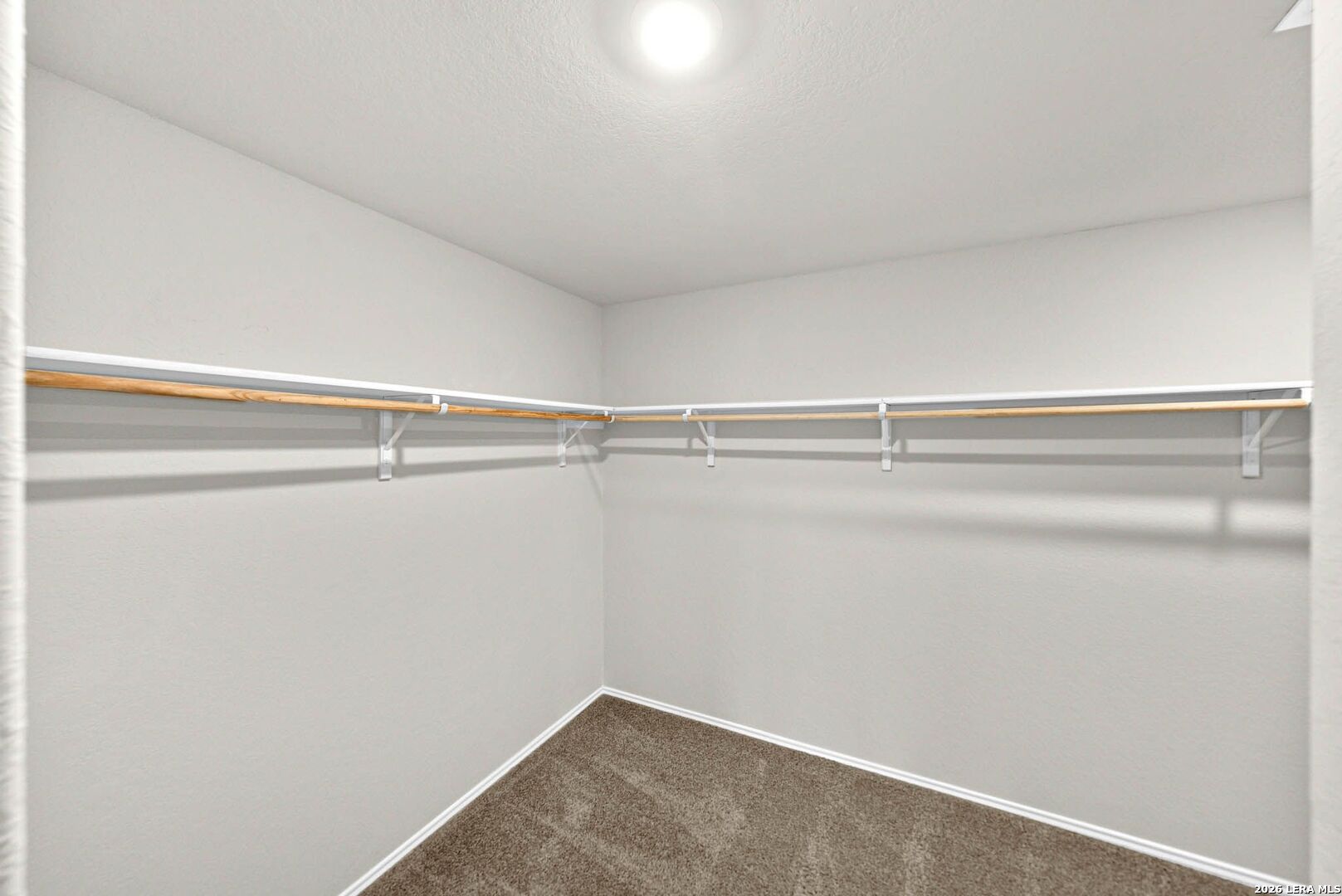 917 Chachalaca Court Seguin, TX 78155 - Photo 23 of 44 a view of a room with racks on the wall