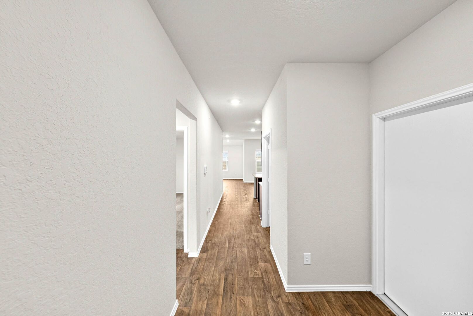 917 Chachalaca Court Seguin, TX 78155 - Photo 5 of 44 a view of a hallway with wooden floor