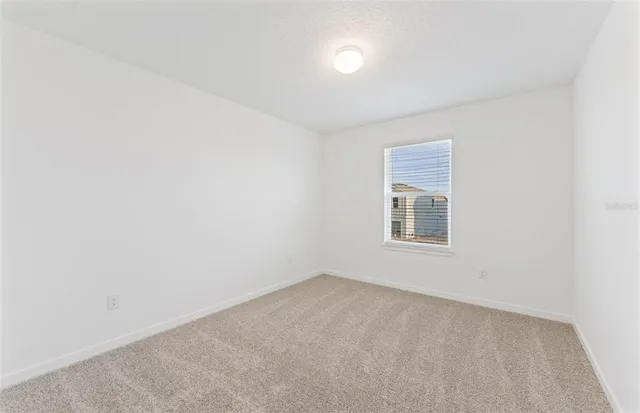 a bathroom with a double vanity sink a toilet and a bathtub