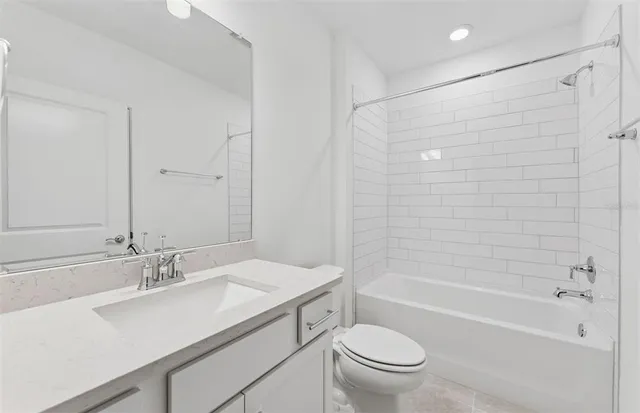 a bathroom with a sink a toilet and a bathtub