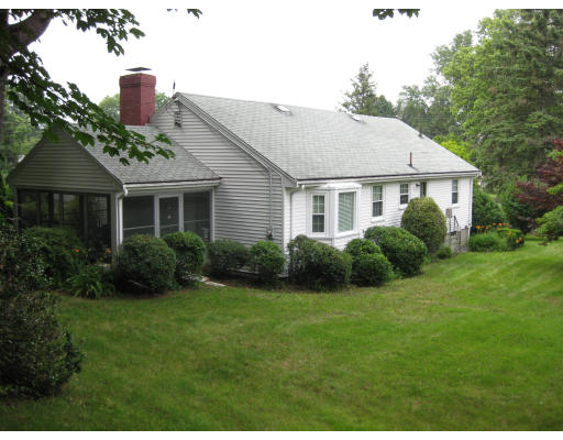 47 Webster Road Lexington, MA 02421 - Photo 3 of 7 a front view of a house with a yard