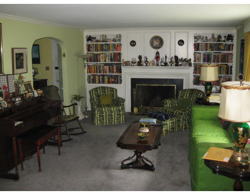 47 Webster Road Lexington, MA 02421 - Photo 6 of 7 a living room with furniture and a fireplace