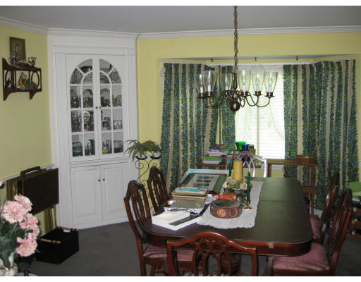 47 Webster Road Lexington, MA 02421 - Photo 7 of 7 a view of a dining room with furniture and chandelier