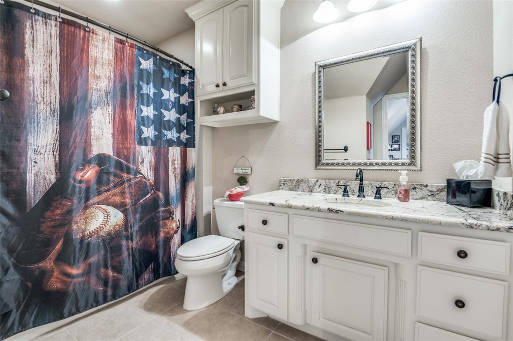 4041 Blackchamp Road Midlothian, TX 76065 - Photo 18 of 34 Full ensuite bathroom upstairs, granite tops, tile floors and ample storage!