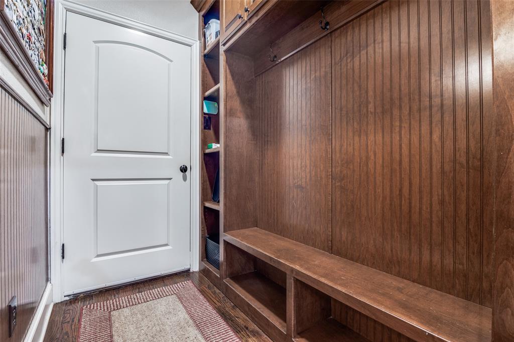 4041 Blackchamp Road Midlothian, TX 76065 - Photo 26 of 34 Mud room off garage with built ins. This area provides access to the private stairs leading to the second floor master, and access to the half bathroom.