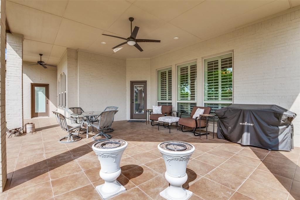 4041 Blackchamp Road Midlothian, TX 76065 - Photo 28 of 34 Tiled and covered back patio gives plenty of room for outdoor entertaining!