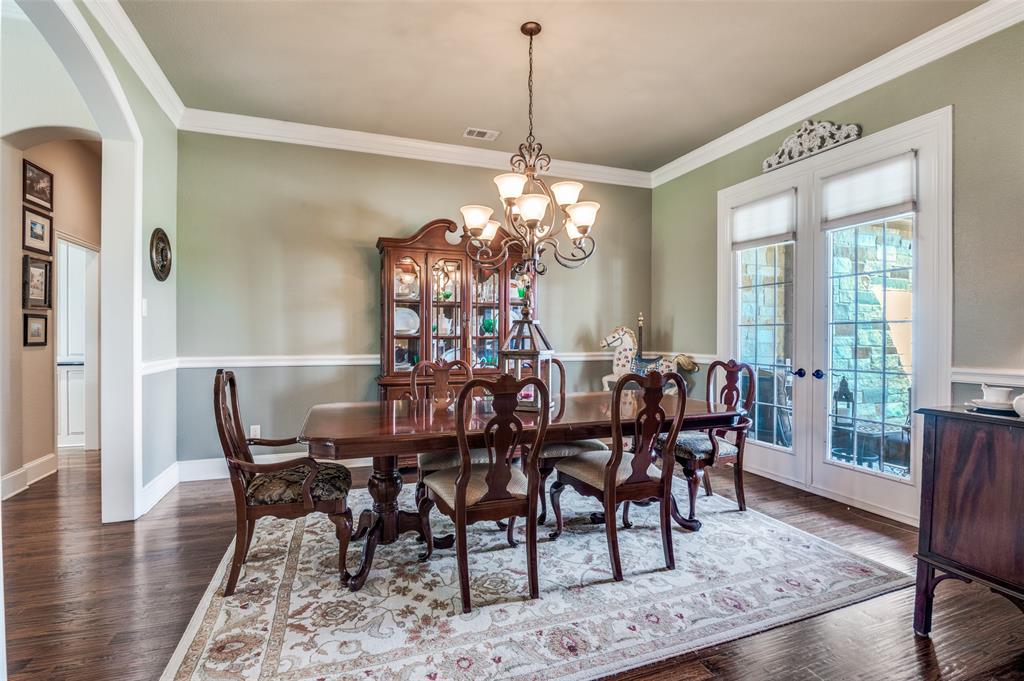 4041 Blackchamp Road Midlothian, TX 76065 - Photo 4 of 34 Formal dining with doors that open to front porch! Crown molding throughout. Lots of space for buffet and china cabinet. Located off entry and quick access to the kitchen.