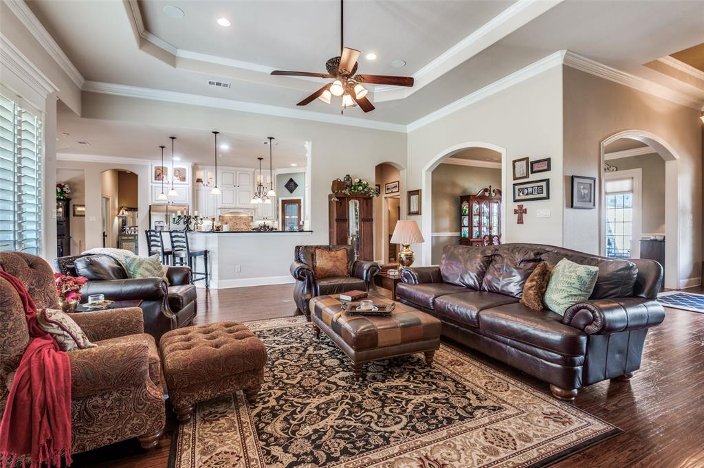 4041 Blackchamp Road Midlothian, TX 76065 - Photo 10 of 34 Plantation blinds, custom trim work, open and inviting living room!