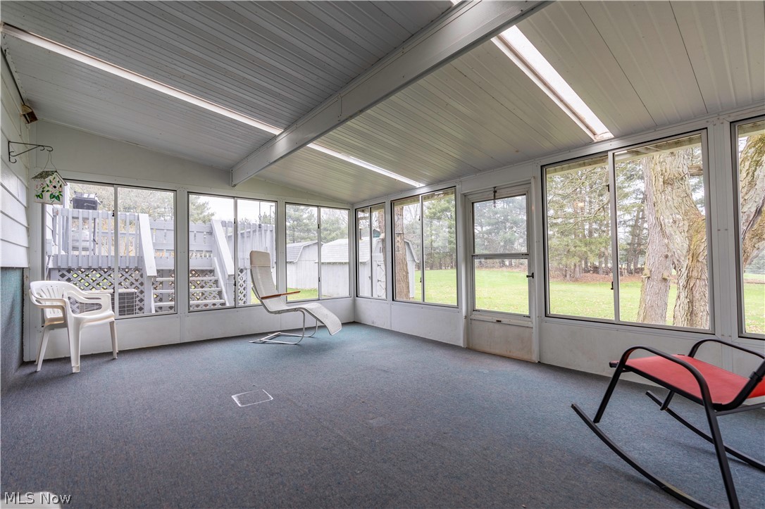 2159 Portage Line Road Mogadore, OH 44260 - Photo 15 of 35 Unfurnished sunroom featuring lofted ceiling with beams