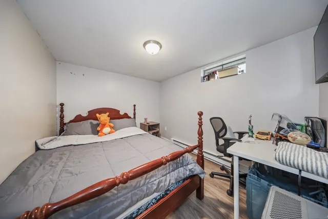 a bedroom with a bed and a table