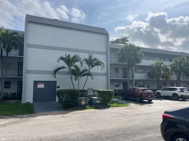 a cars parked in front of a building
