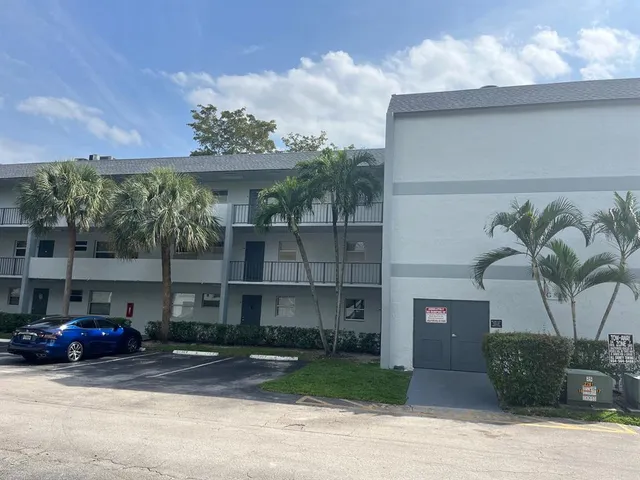a view of a car parked in front of a building