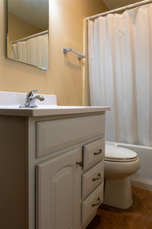 167 Blue Water Point Holly Lake Ranch, TX 75765 - Photo 17 of 27 Vanity with paneled cabinetry, polished chrome faucet, and white countertop