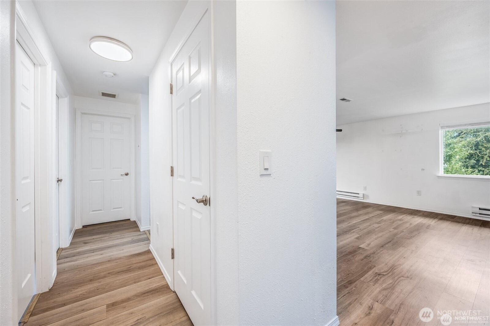 105 96th Street East Tacoma, WA 98445 - Photo 20 of 40 a view of a hallway with wooden floor