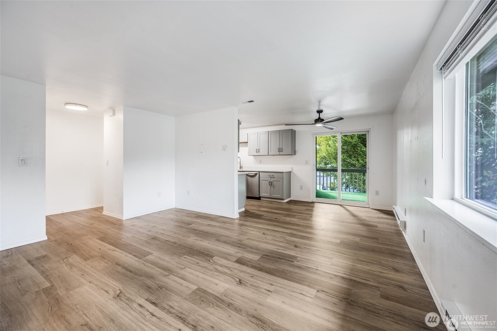 105 96th Street East Tacoma, WA 98445 - Photo 30 of 40 a view of empty room with wooden floor and fireplace