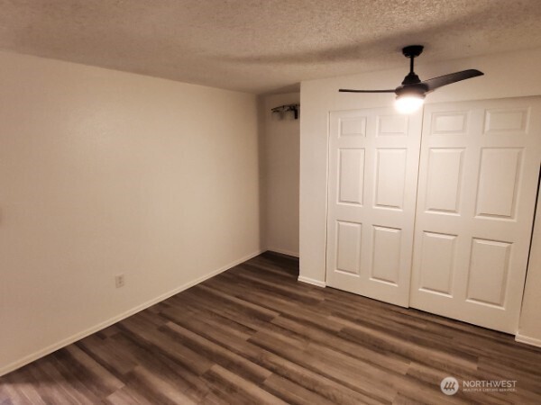 105 96th Street East Tacoma, WA 98445 - Photo 39 of 40 a view of empty room with wooden floor