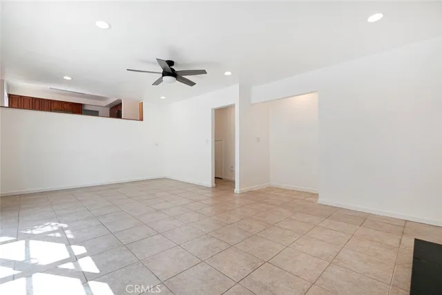 a kitchen with stainless steel appliances granite countertop wooden cabinets a stove top oven a sink and dishwasher