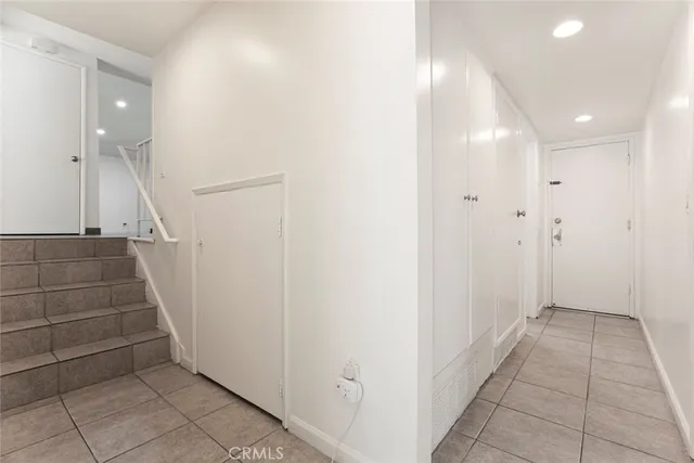 a kitchen with a sink and wooden cabinets