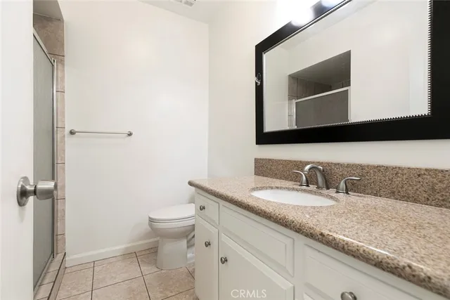 a view of outdoor space with wooden floor and a window
