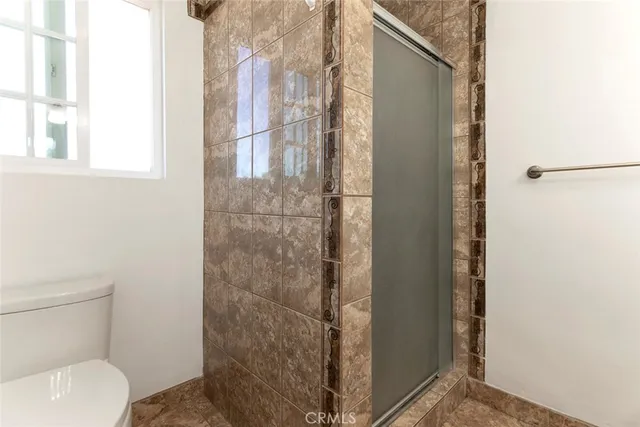 a view of a patio with table and chairs and potted plants
