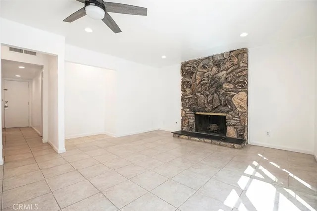 a view of a backyard with wooden fence