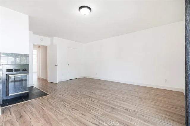 swimming pool view with a seating space and a garden view